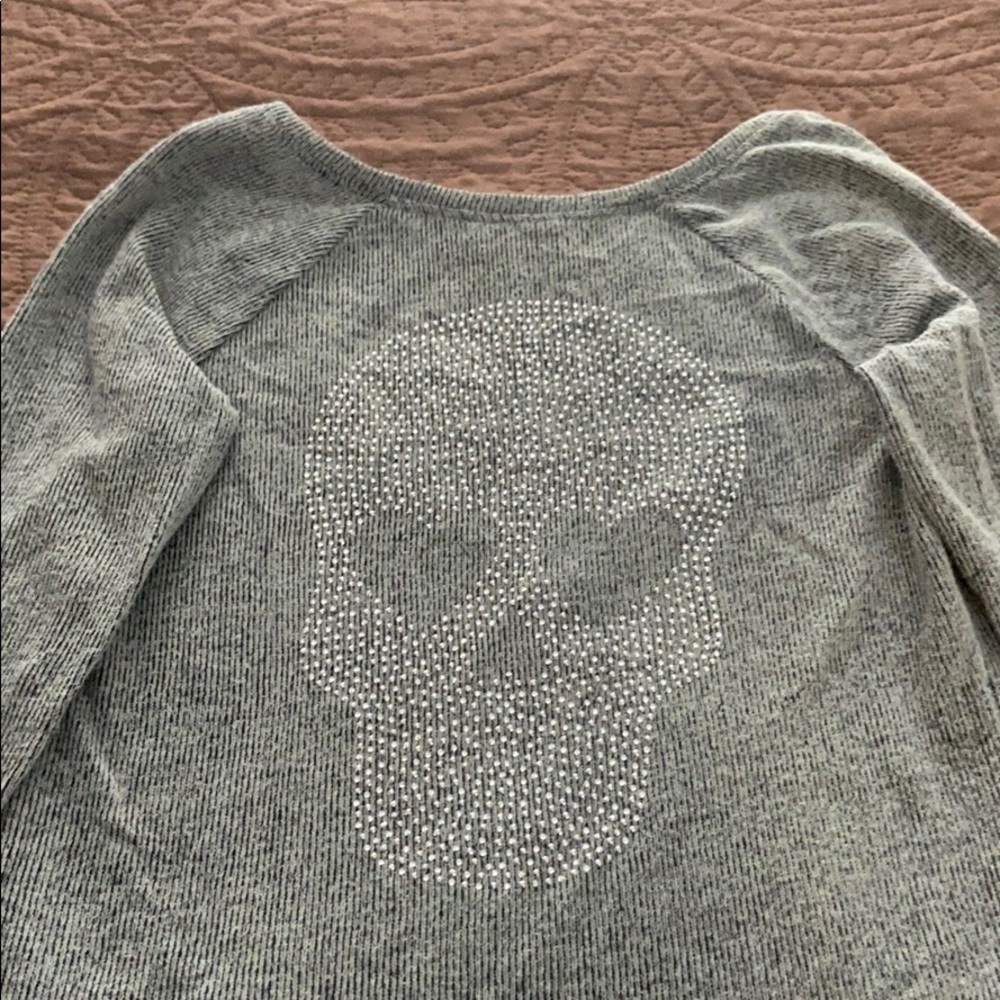 VS pink skull sweater. Scooped back